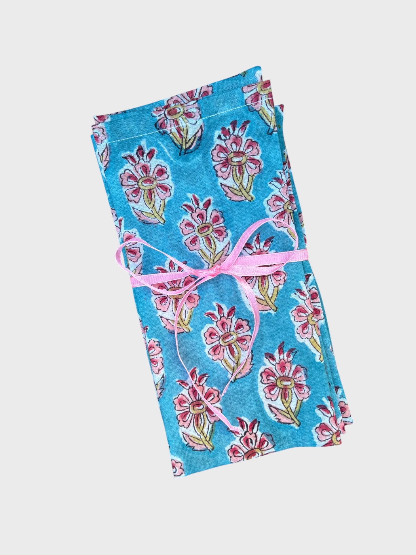 A set of blue block printed napkins with hibiscus flower