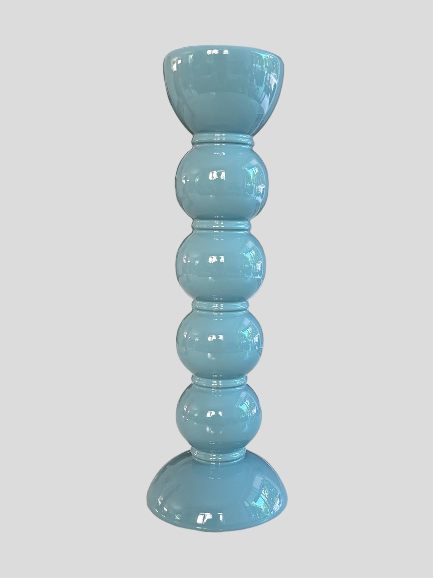 A tall bobbin shaped blue lacquer candlestick from Addison Ross