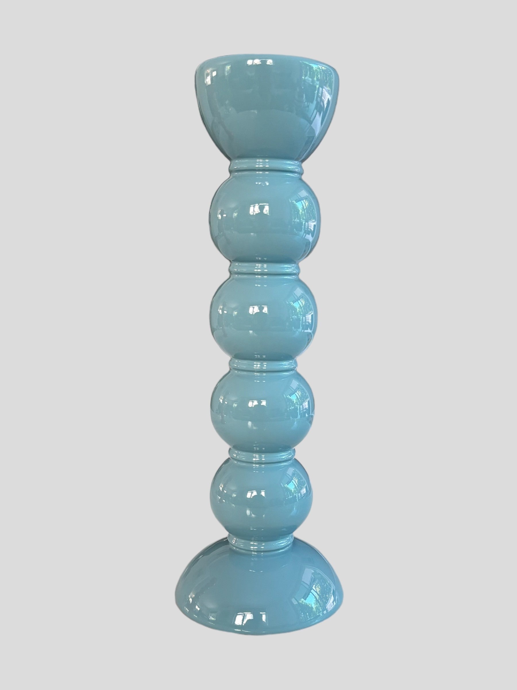A tall bobbin shaped blue lacquer candlestick from Addison Ross