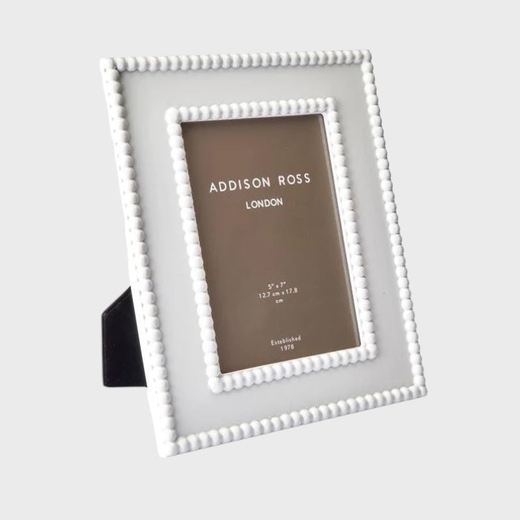White beaded photo frame with 'Addison Ross London' branding on a light gray background