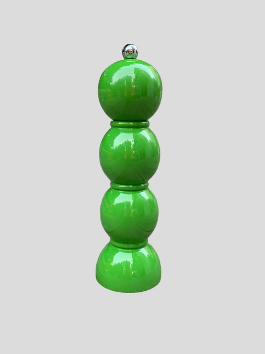 A green bobbin shaped pepper mill.