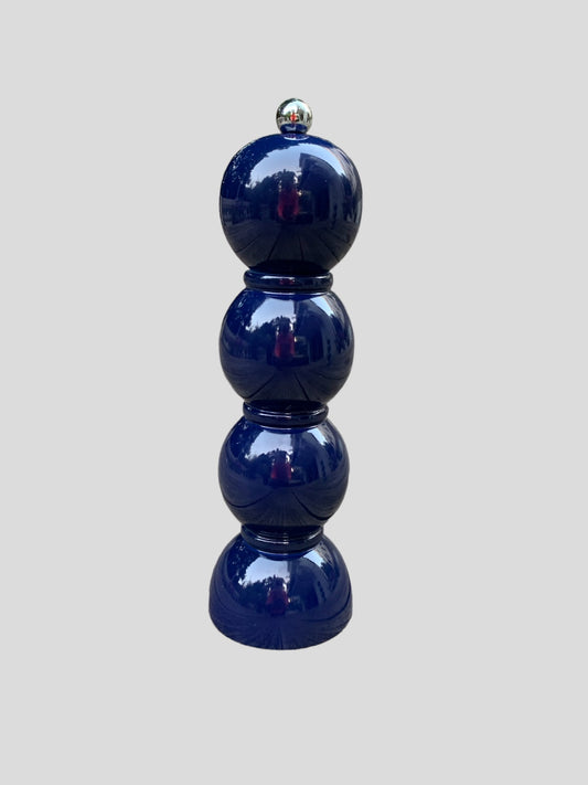 A navy lacquered bobbin pepper grinder.