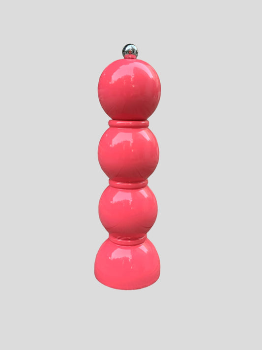 A 3 bobbin shaped pepper grinder.  Highly lacquered in a pink watermelon colour.