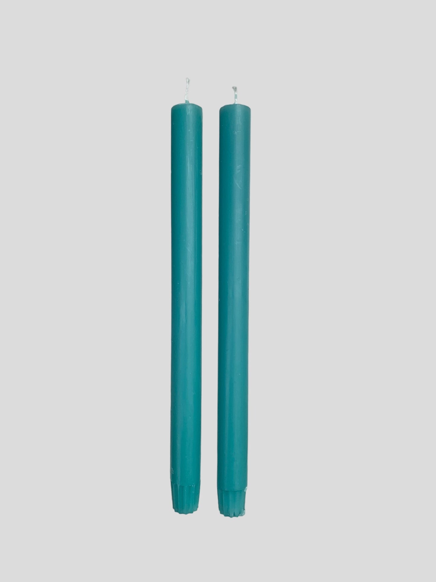 A pair of turquoise candles from True Grace