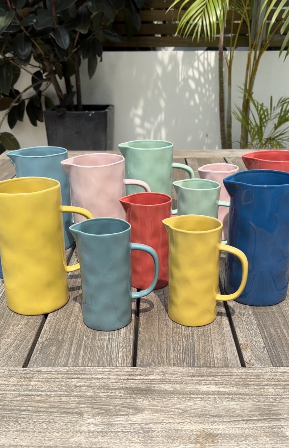 A selection of colourful handmade jugs