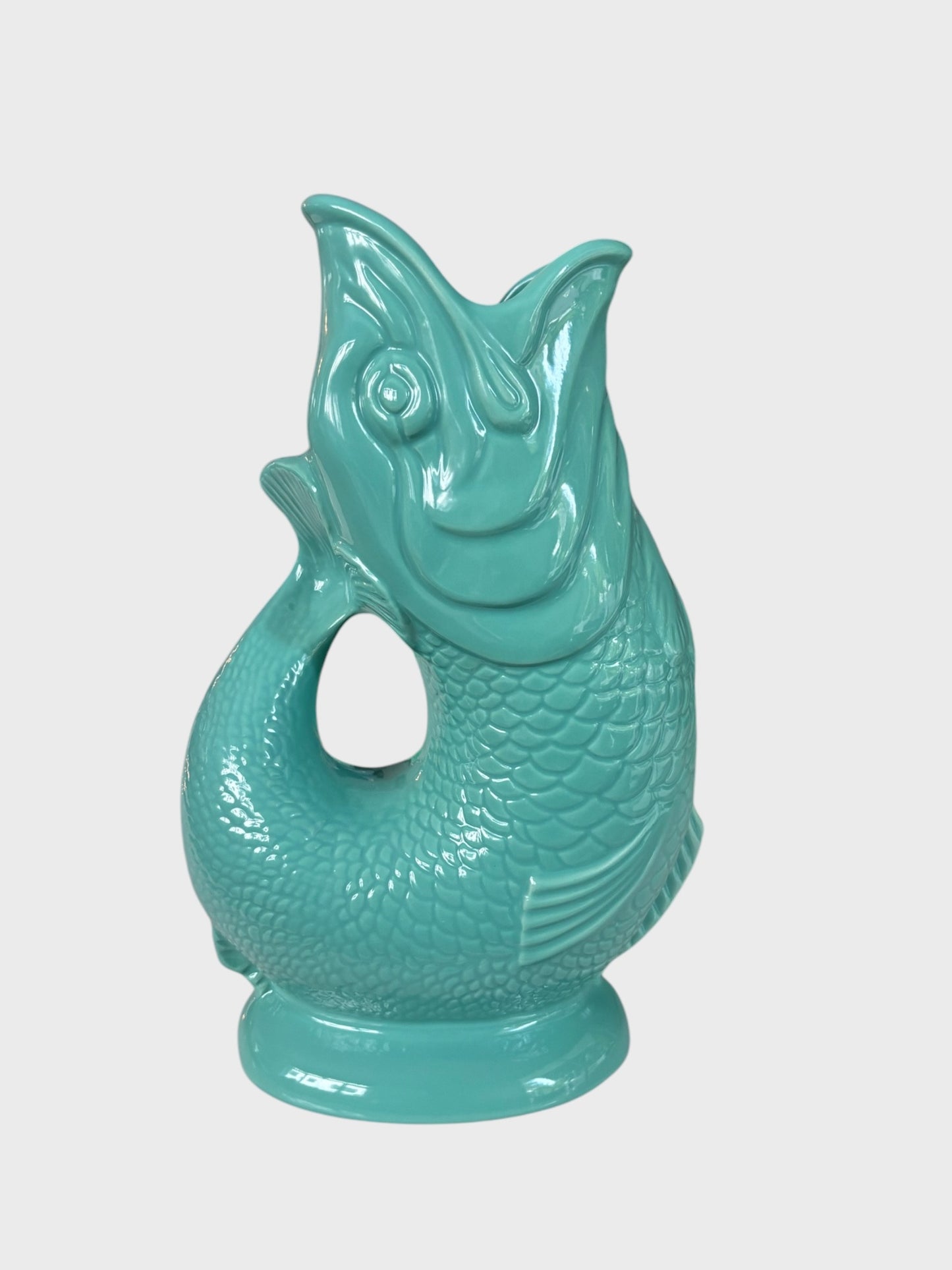 A gluggle jug in sea green colour