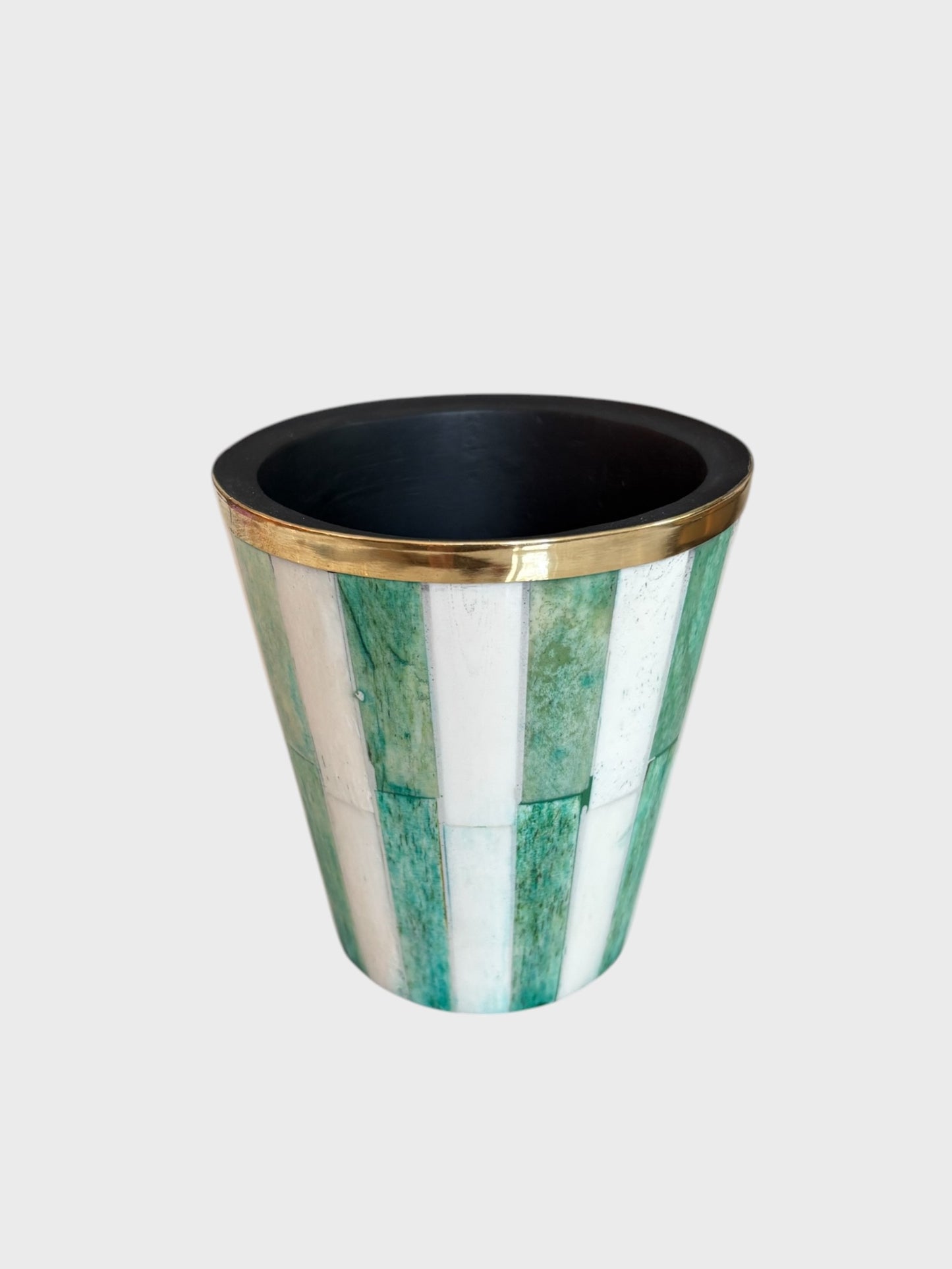 A green and white striped brush pot