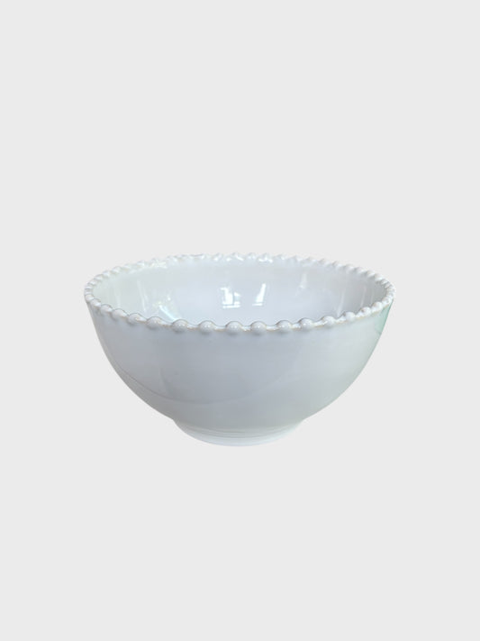 A white cereal bowl with beaded edging