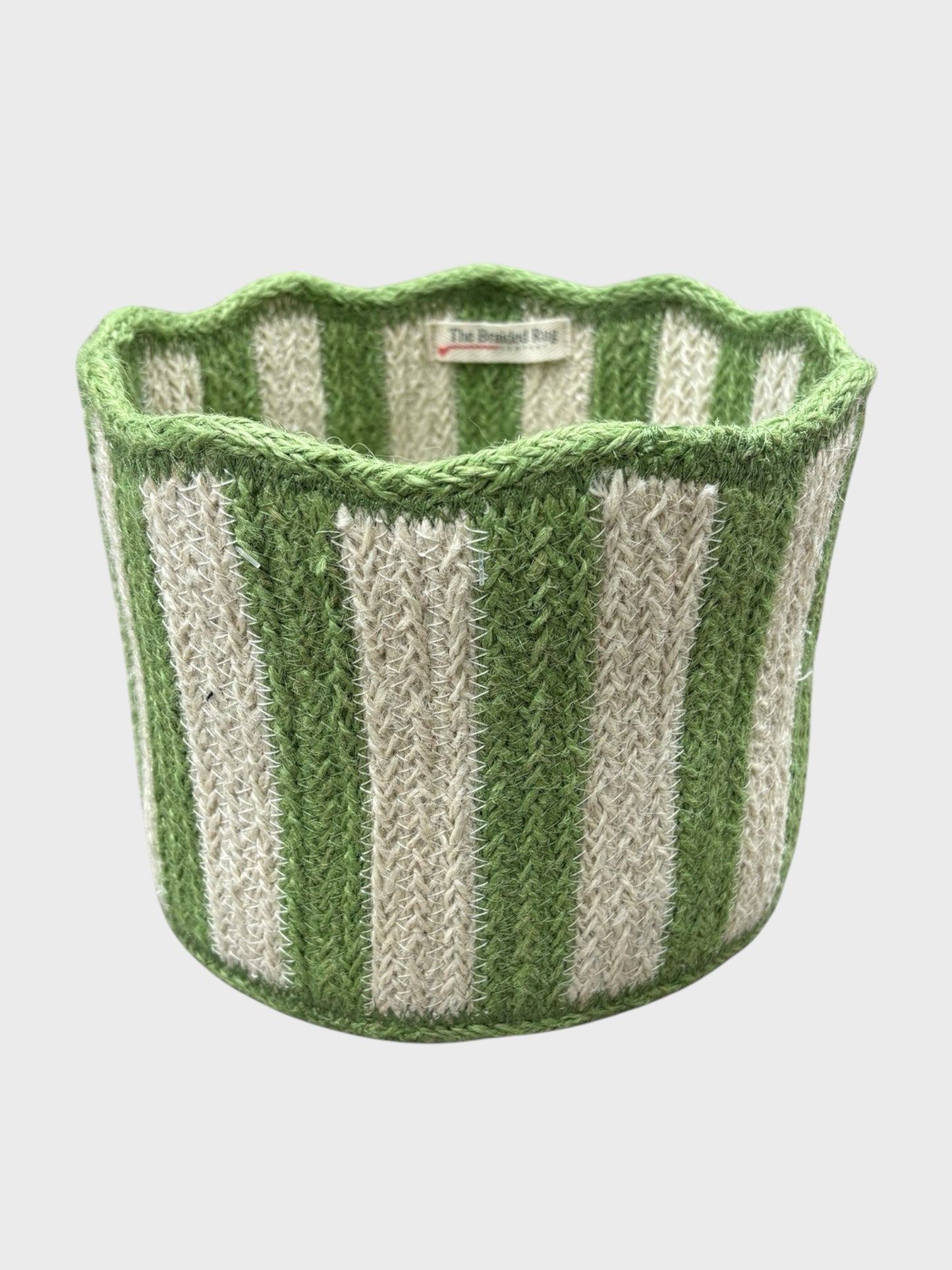 An organic jute tulip basket with green stripes