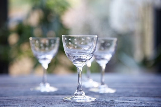 Crystal liqueur glasses with hand-etched stars.