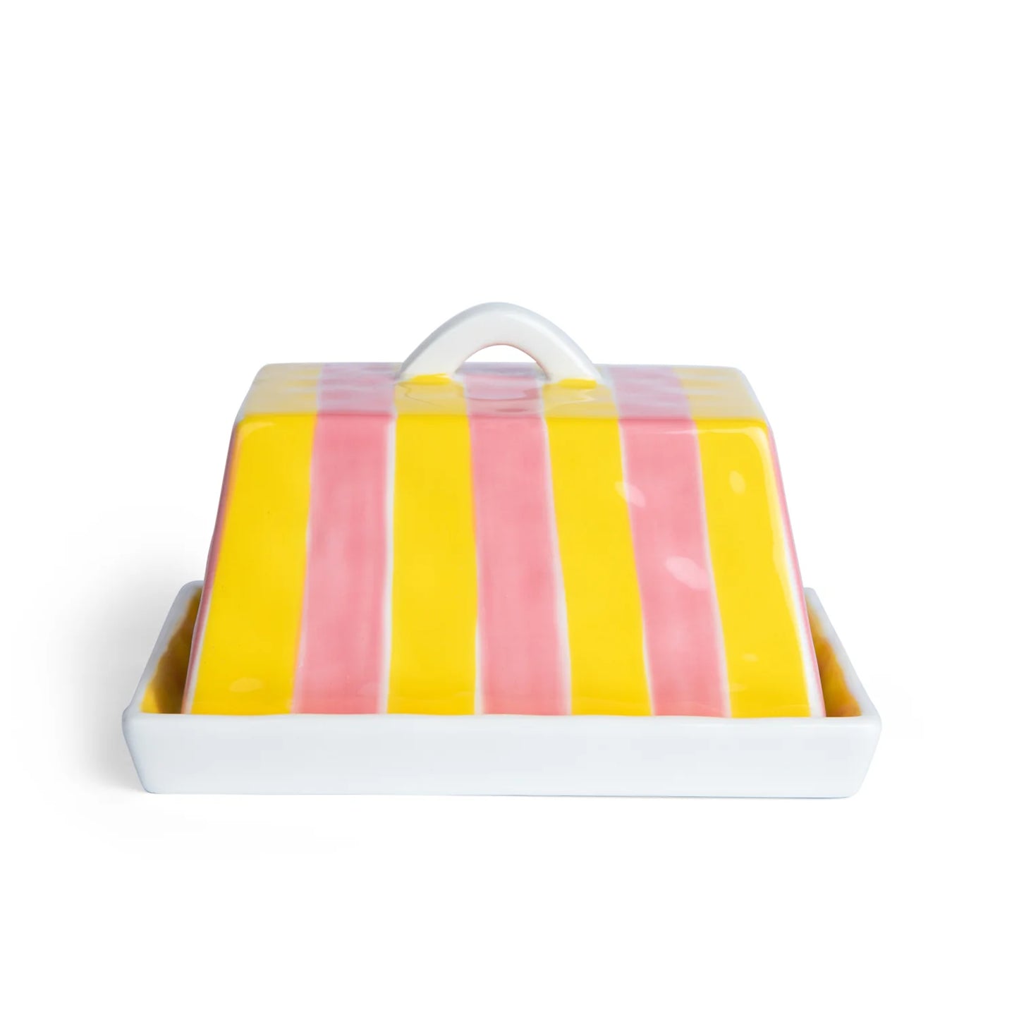 Colorful striped butter dish with a white handle on a white background