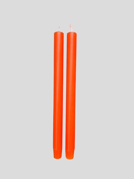 A pair of orange candles from True Grace