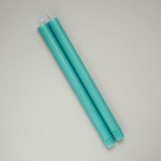 Two turquoise dinner candles from True Grace