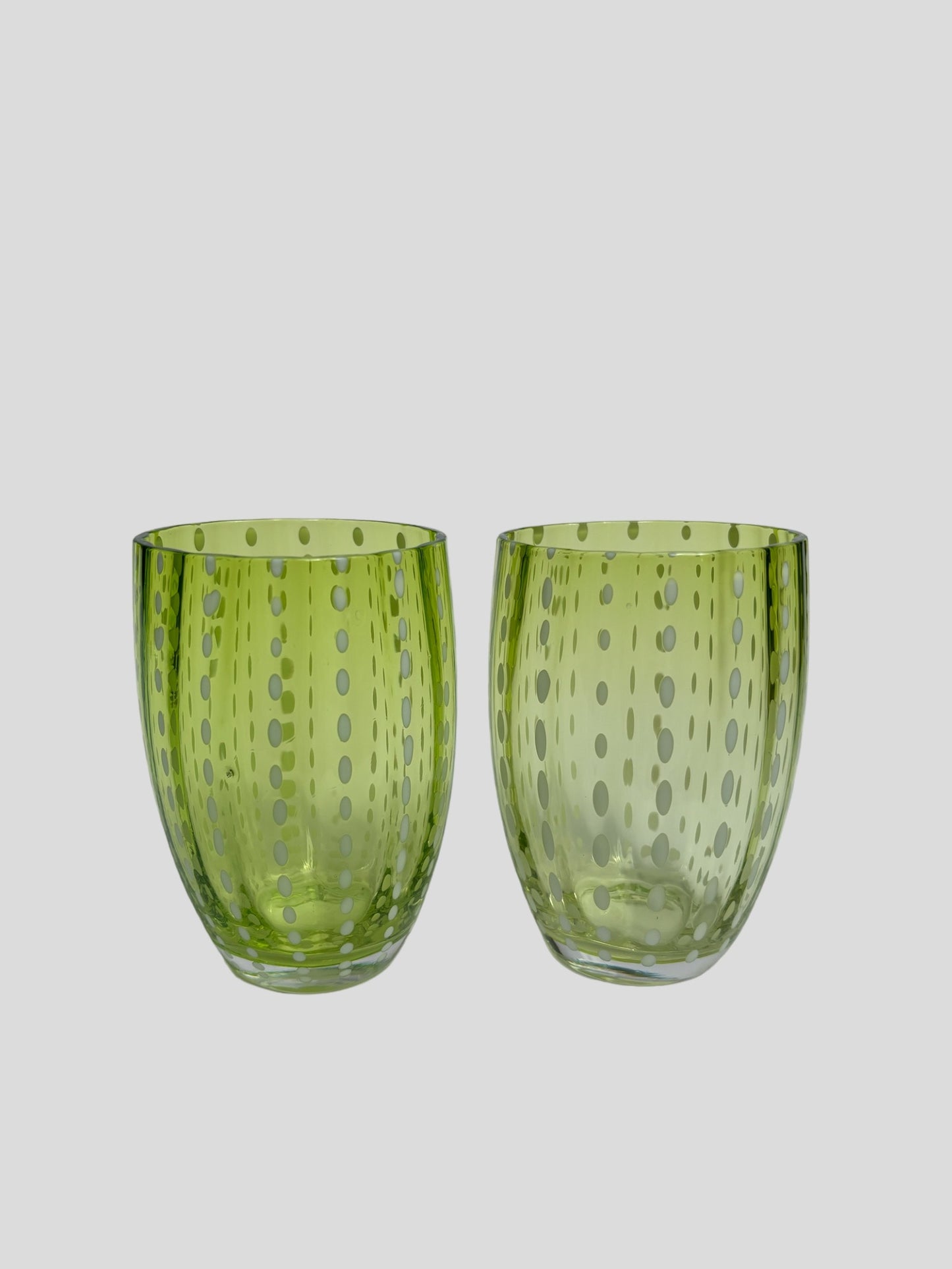 A pair of apple green glass tumblers with hand-painted dot design