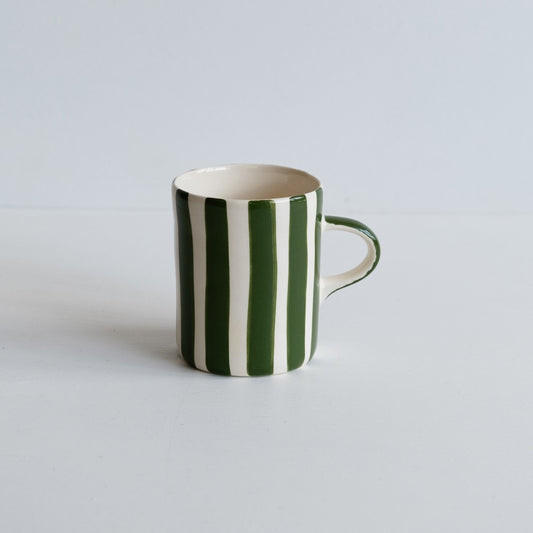 A green and white candy striped mug from Musango