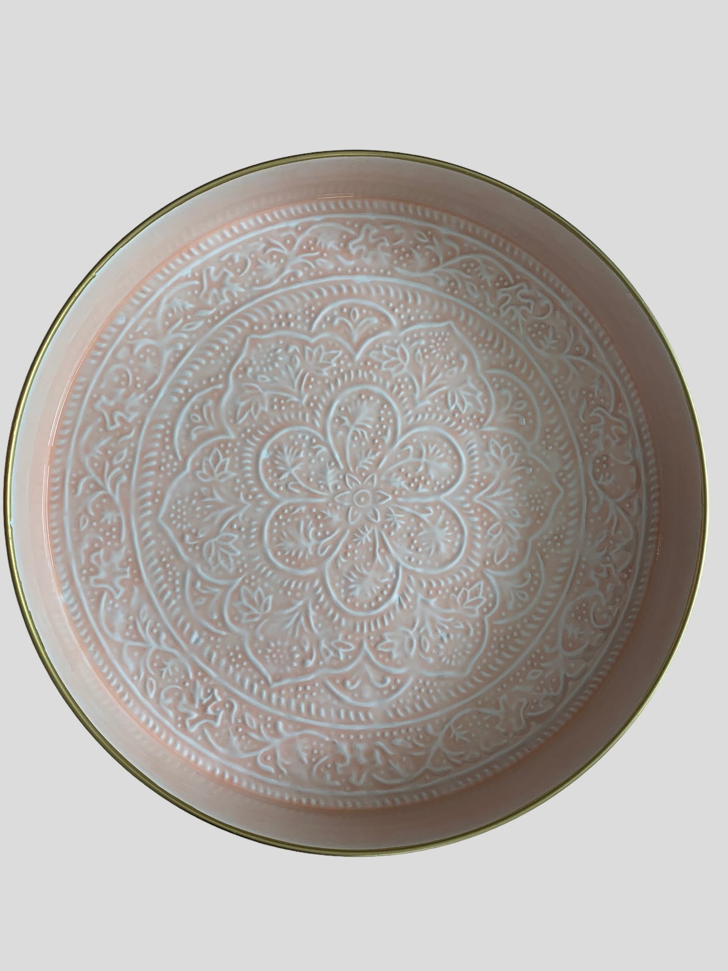large round, pink enamel serving tray with embossed detail