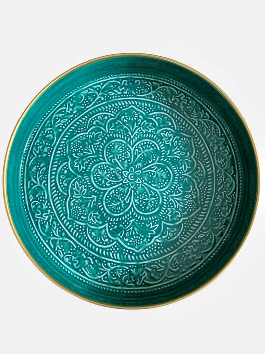 A large, teal coloured enamel tray with floral embossing.