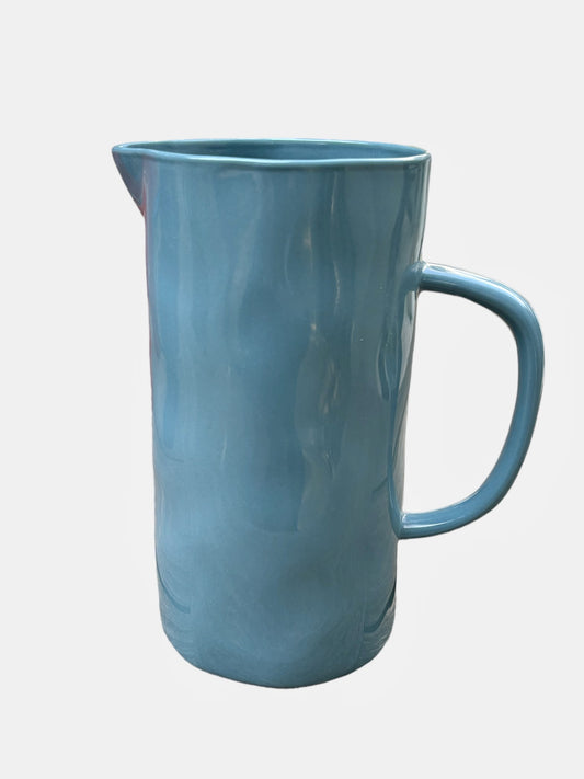A large blue ceramic jug