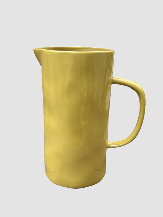 A large hand-painted yellow jug
