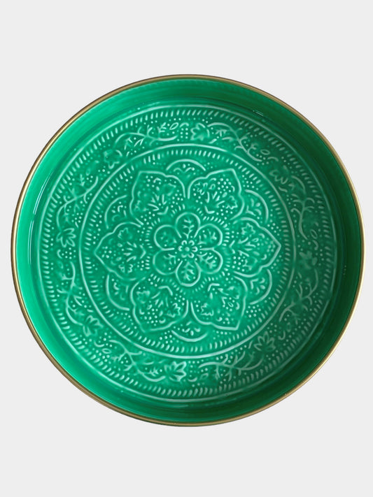 A medium sized green enamel tray with floral embossing detail.