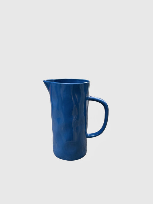 A medium sized blue handmade jug