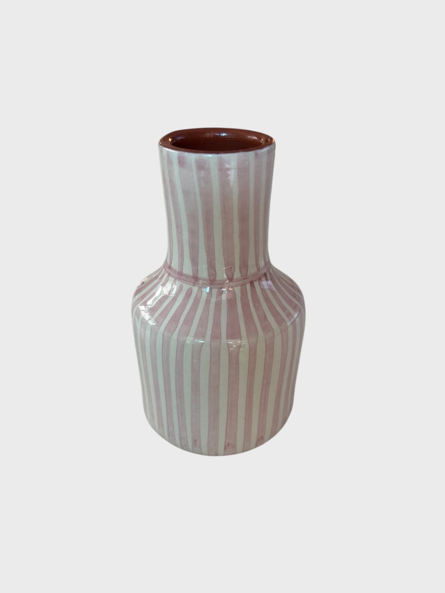 A mini striped garafe vase from Casa Cubista in pink and white