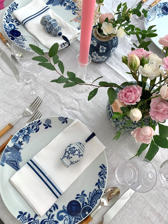 A tablescape featuring mini ginger jars as place settings.