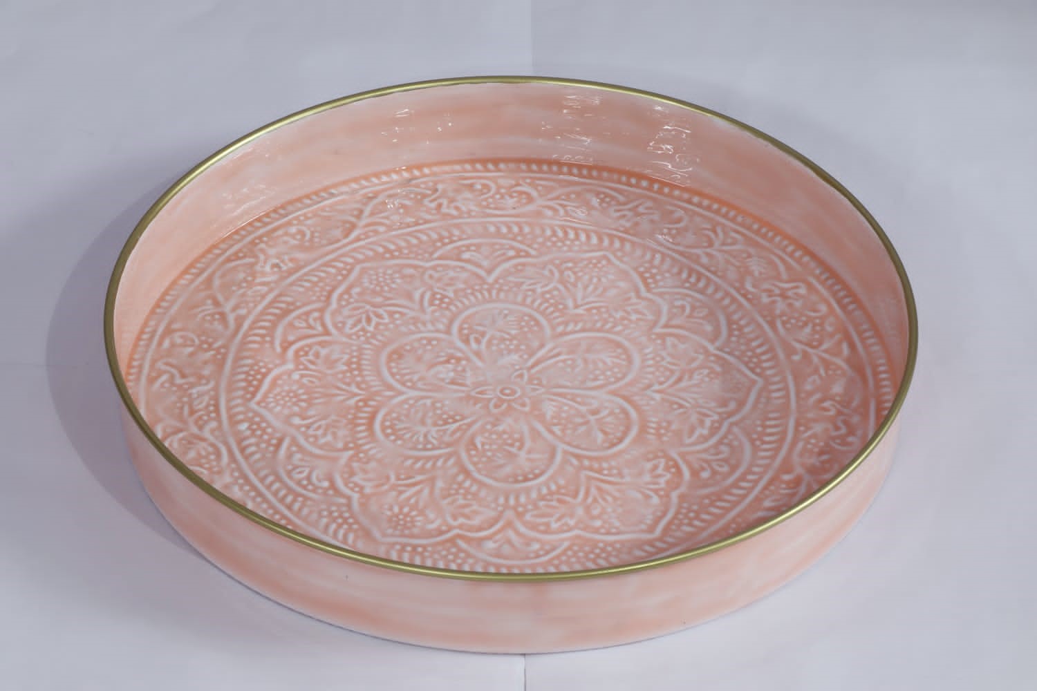 A large embossed enamel serving tray