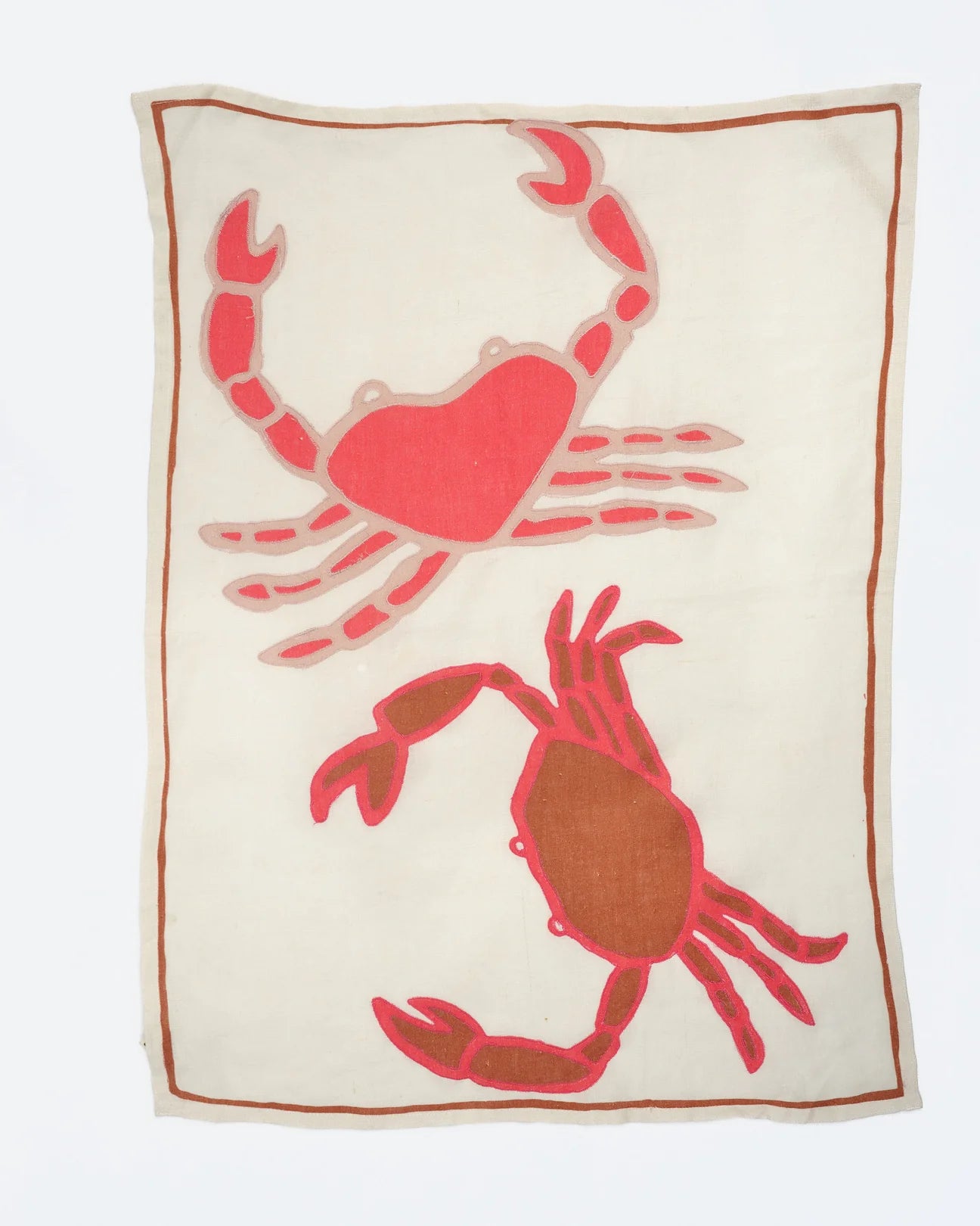 White towel with red crab design on a white background