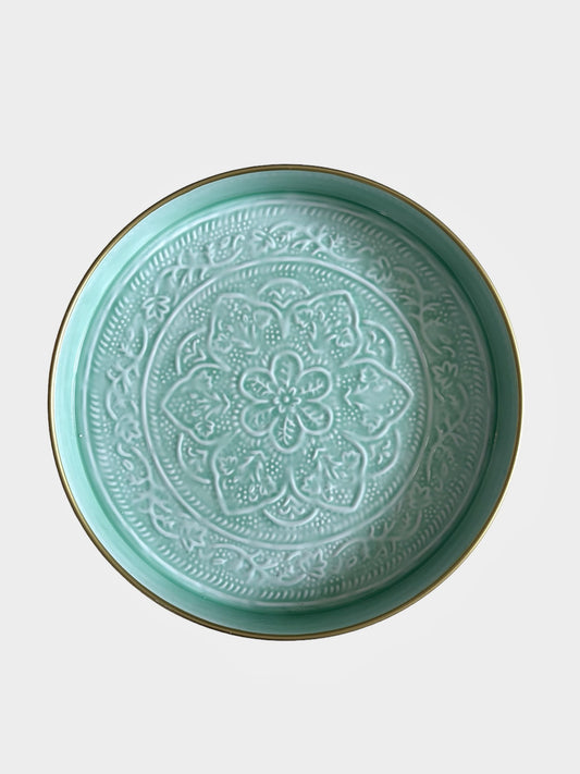 A light blue enamel tray with embossed detail