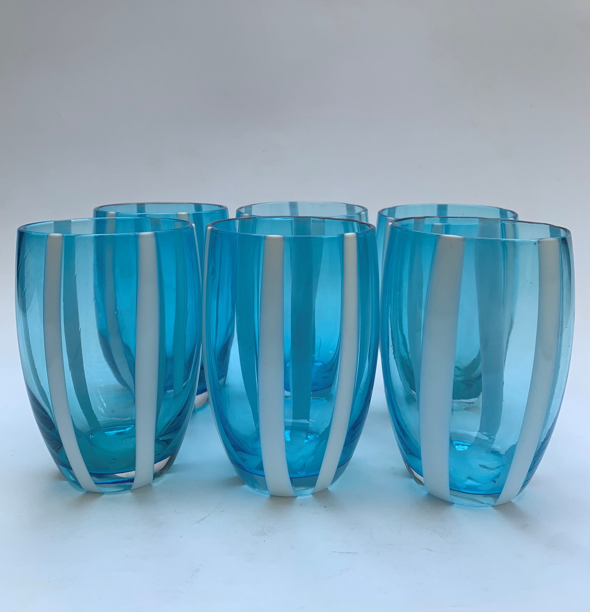 aqua blue glass tumblers with hand-painted white stripes