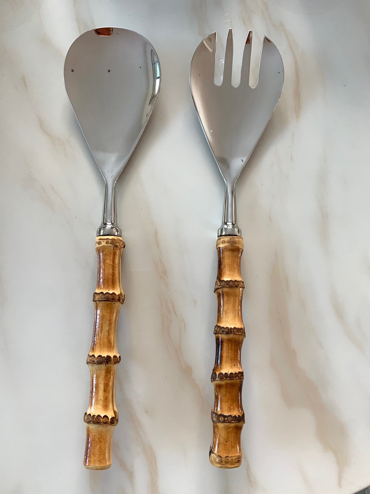 A bamboo serving set comprising of a serving spoon and a serving fork