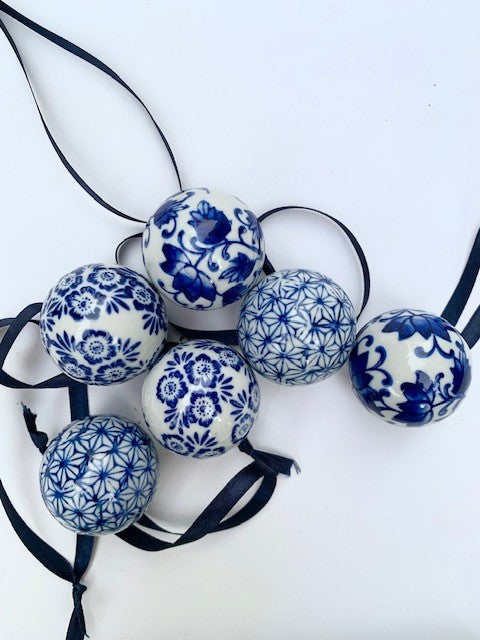 A selection of 6 mini blue and white ceramic baubles