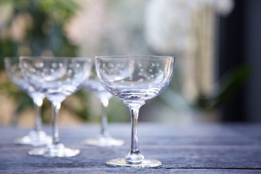 Crystal champagne glasses and coupes with hand-etched stars